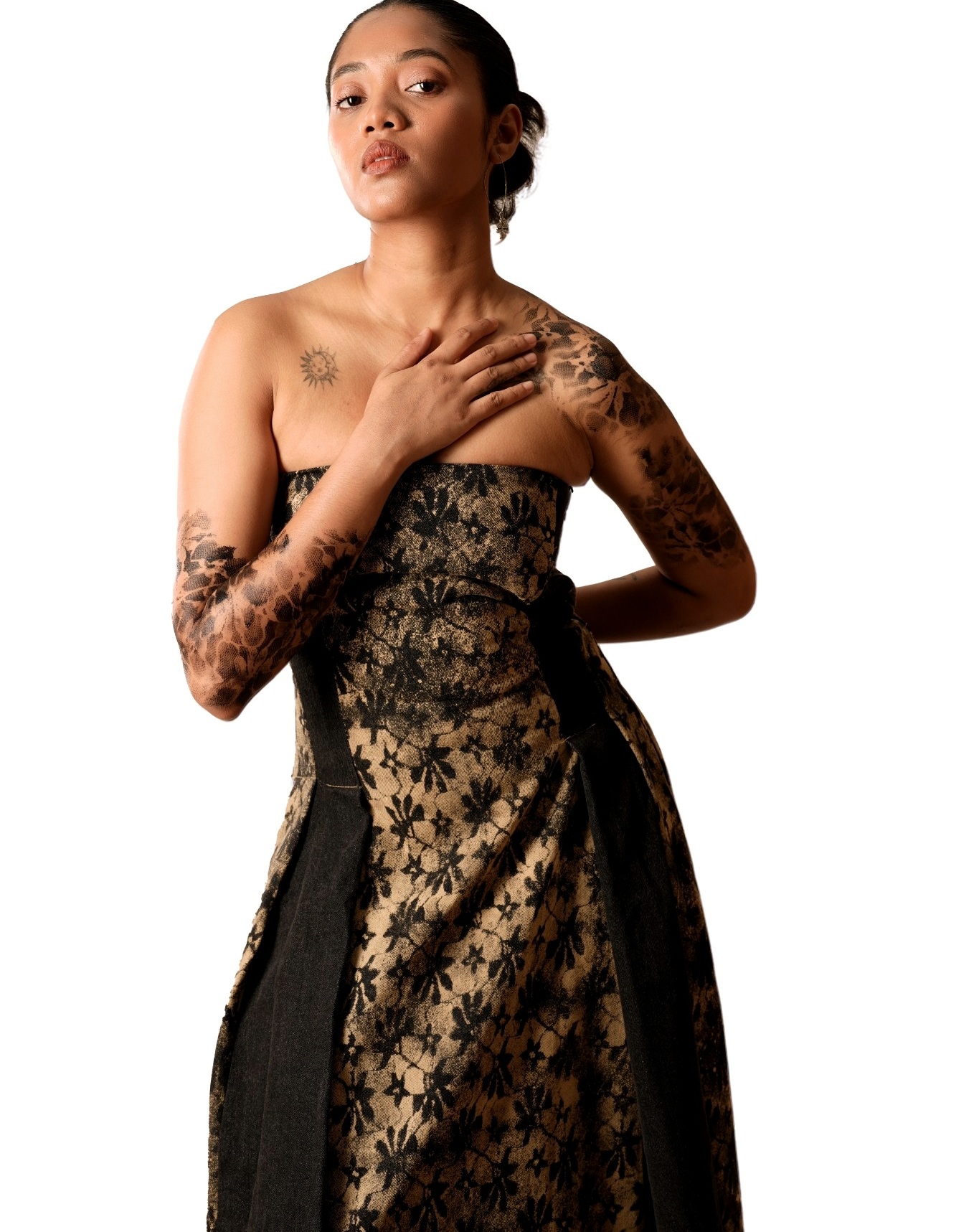 Close portrait highlighting the black and gold textile