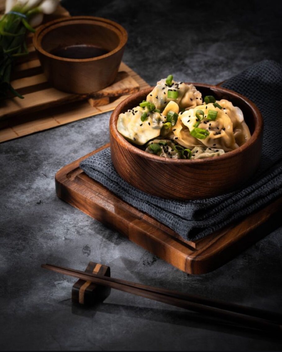 Bowl of dumplings in a wider table setting